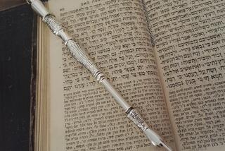Thorah, a saint book of Jews, with a pointer